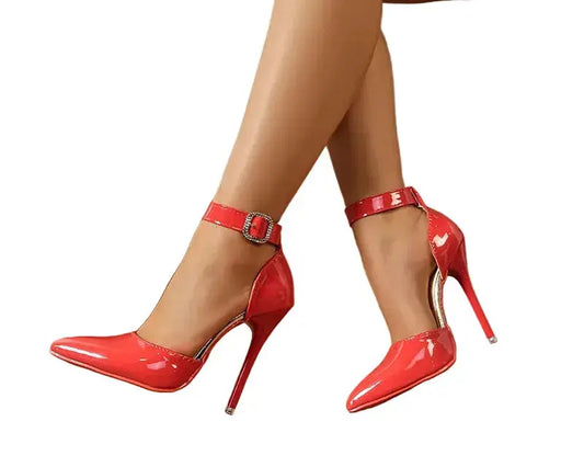 Red high-heeled shoes with a glossy finish on a white background