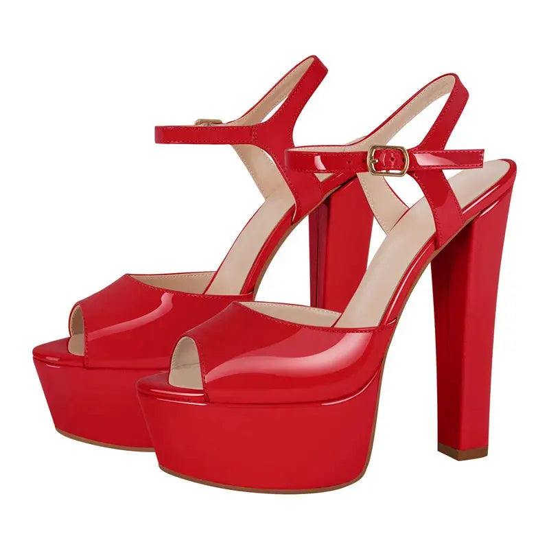 Red high-heeled platform shoes on a white background